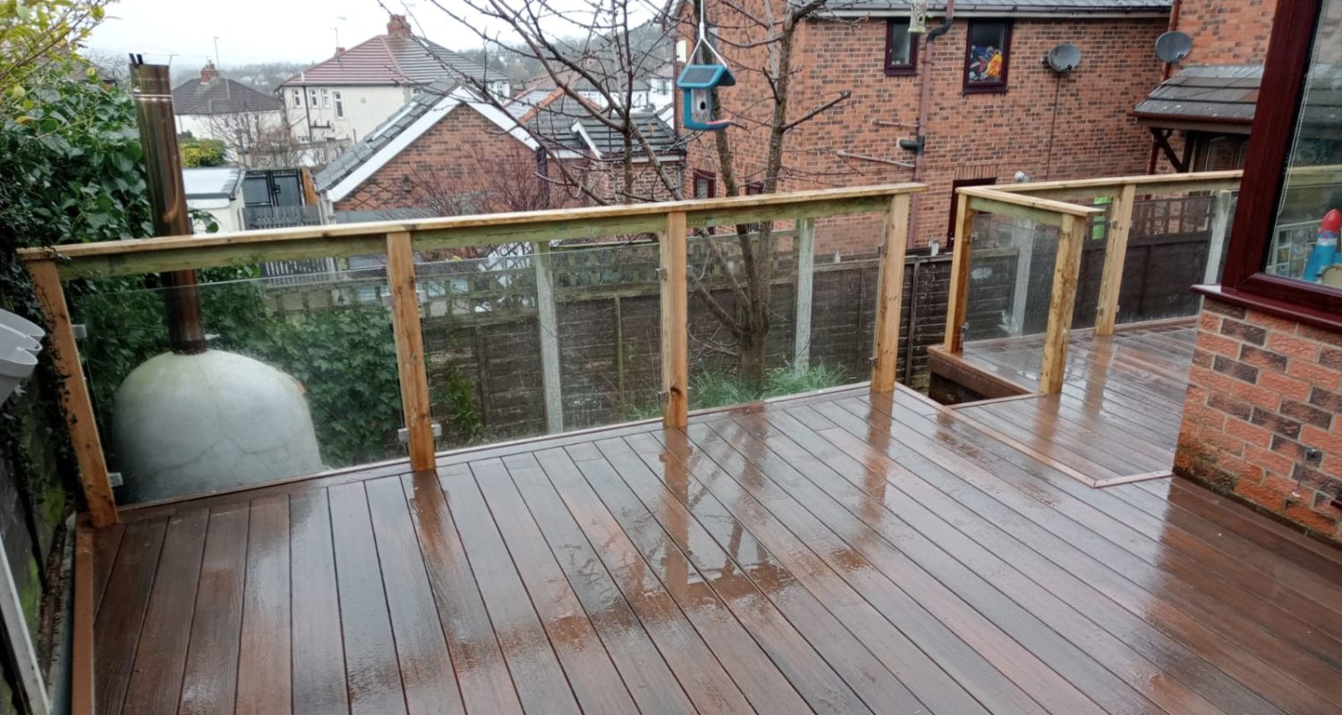 Decking glass balustrade with wooden posts and handrail