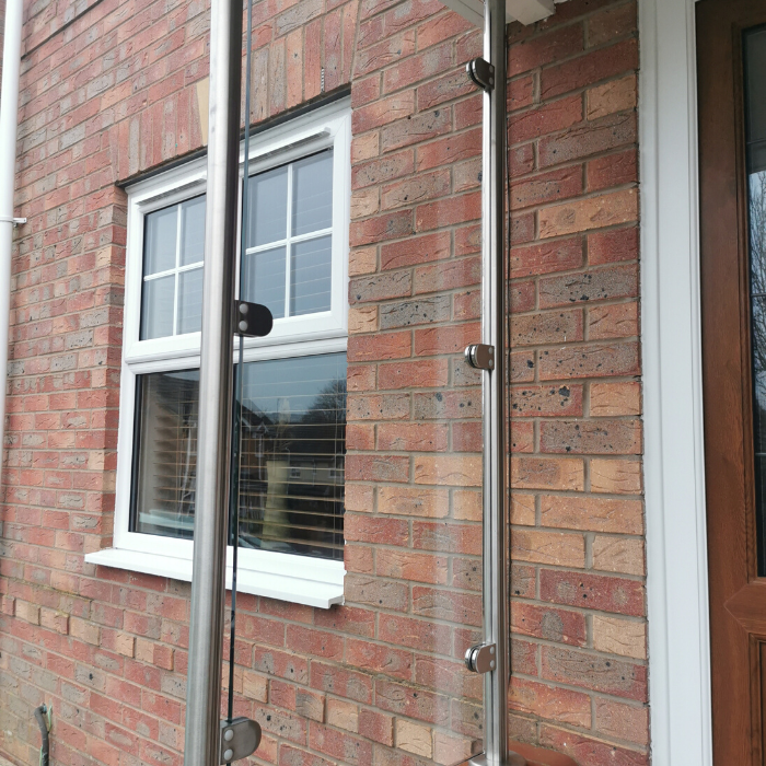 Glass balustrade at the side of a front door